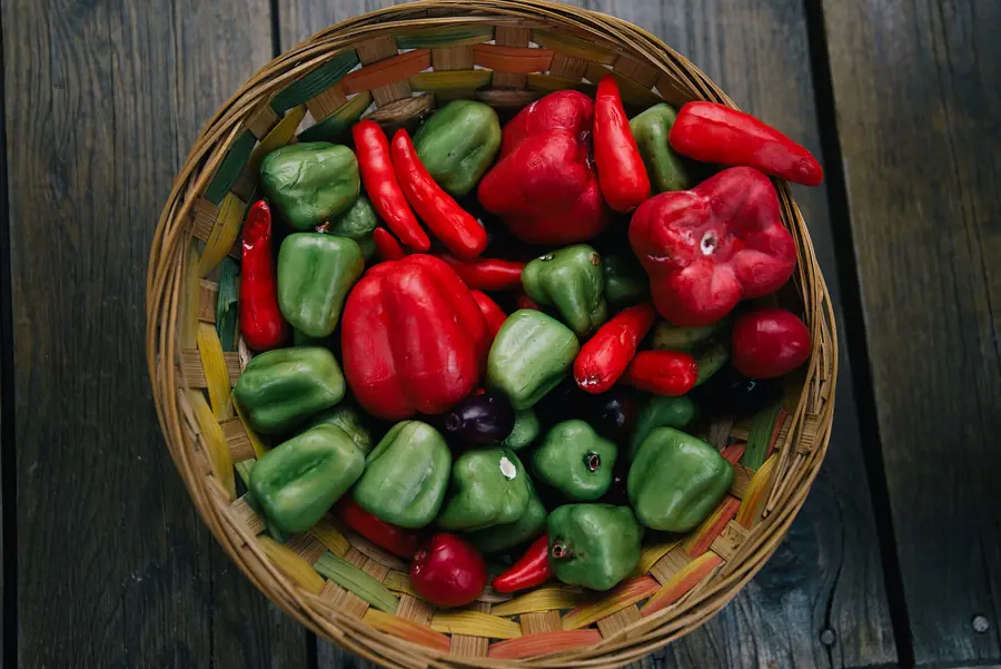 Woven basket of red and green capsicum and chillies