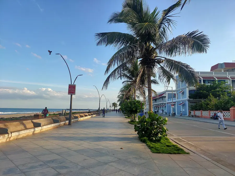 Pondicherry beach promenade with palm trees and the Bay of Bengal
